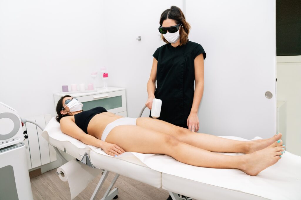 Esthetician giving laser hair removal treatment at Alladerm in Aliso Viejo, CA