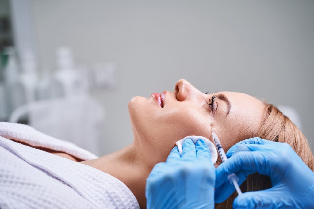 Female client receiving Botox injections at Alladerm medical spa in Aliso Viejo, CA