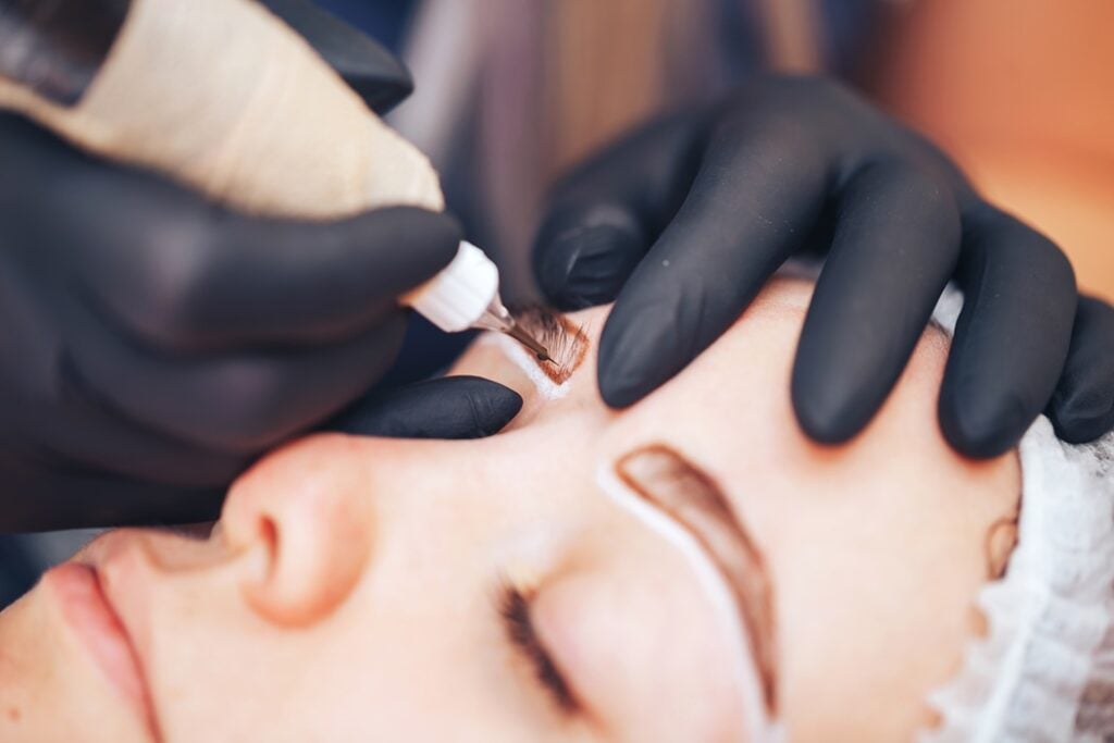 Alladerm Med Spa specialist demonstrating proper microblading aftercare techniques